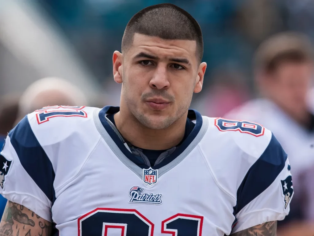 Football player wearing a New England Patriots uniform on the sideline