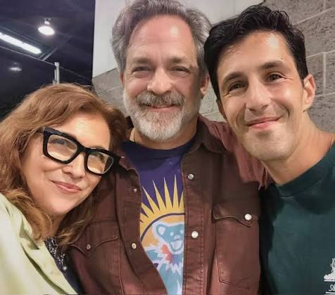 Three people posing together for a casual group photo